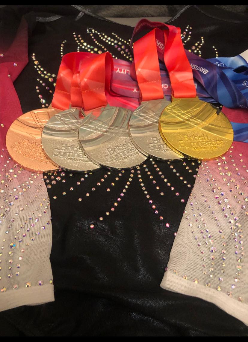 Collection of medals from the Gymnastic Championships in Cardiff.